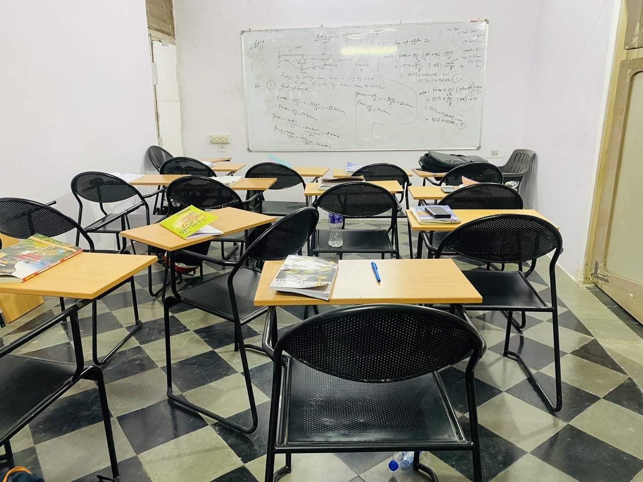 A classroom with the day's working still on the whiteboard